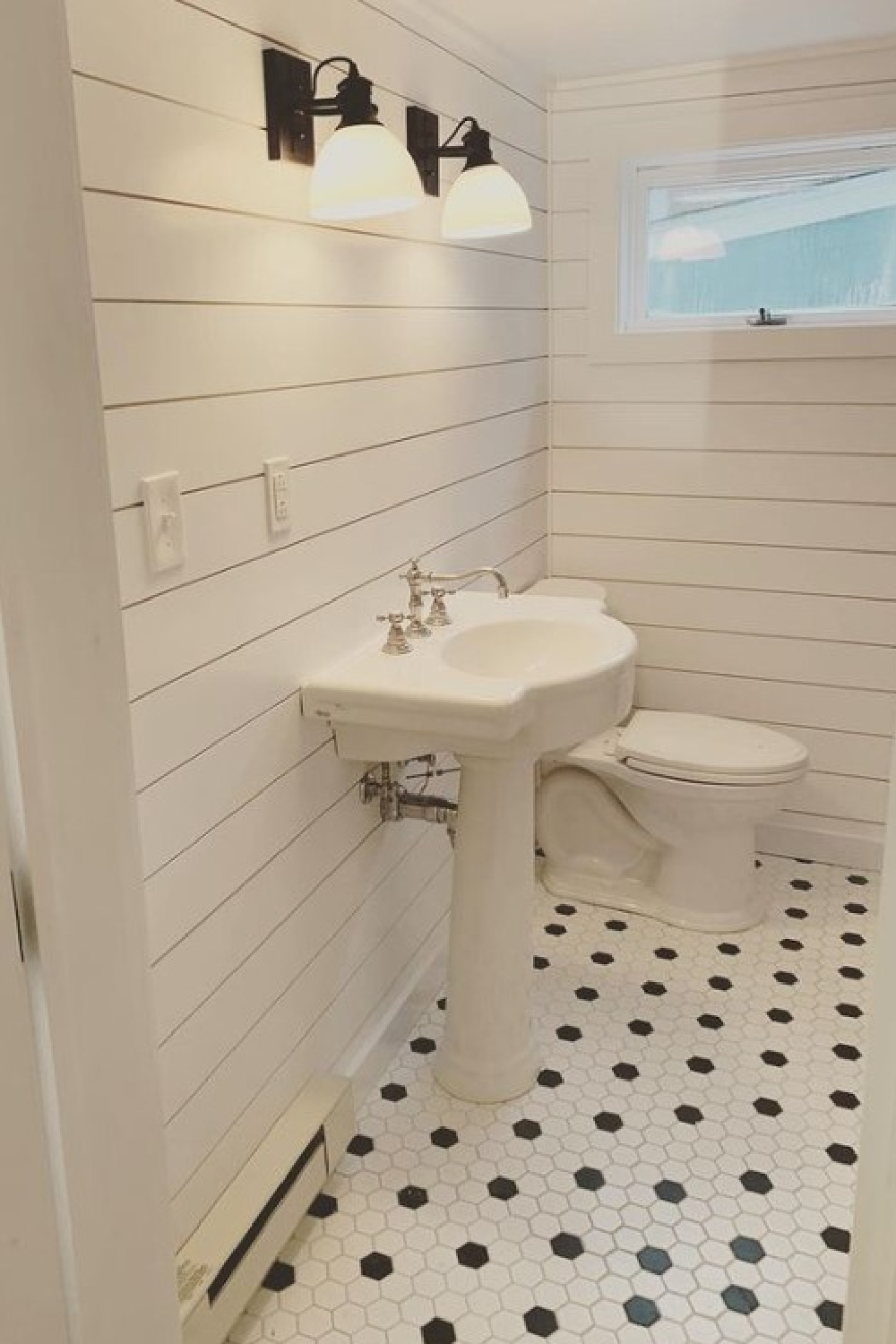 Decorator's White in a classic white bathroom with black and white hex tile flooring and shiplap - @daniellescoastalstyle.