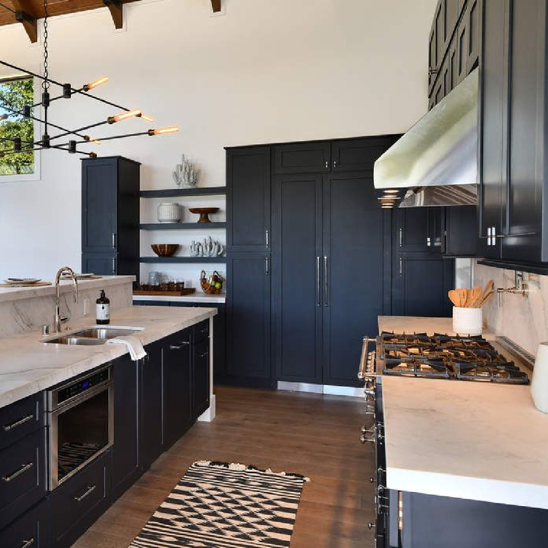 Decorator's White paint on walls in a black kitchen staged by Myra Hoefer Design.