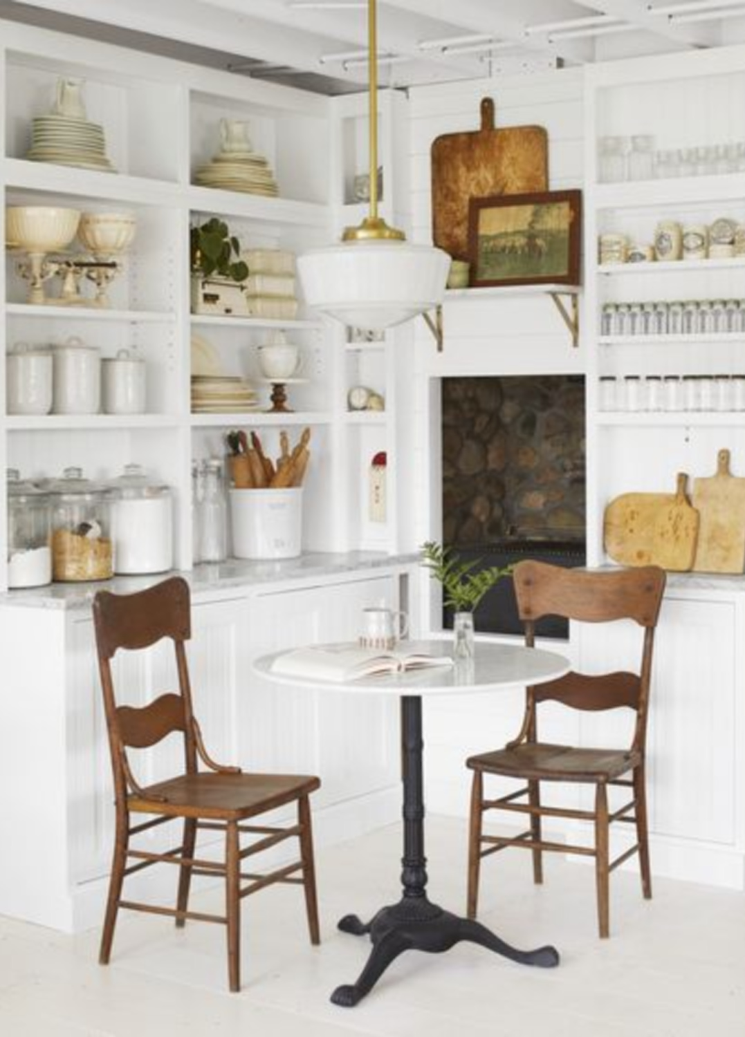 Charming country kitchen breakfast nook with bistro table - photo by David Tsay. #breakfastnooks #farmhousekitchens