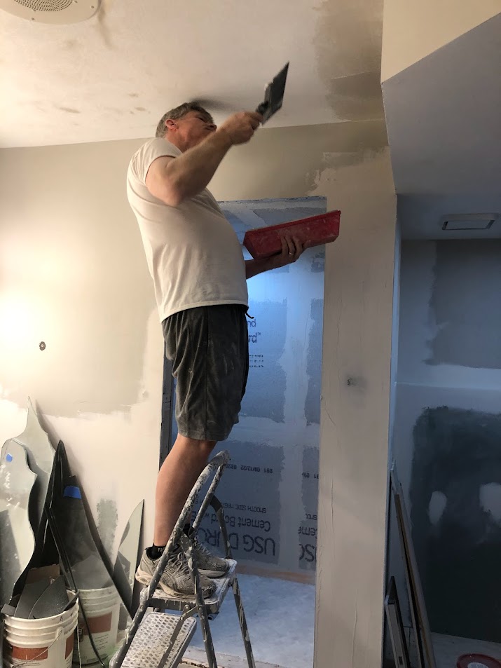 Plastering ceiling during our bath remodel at the Georgian - Hello Lovely Studio.