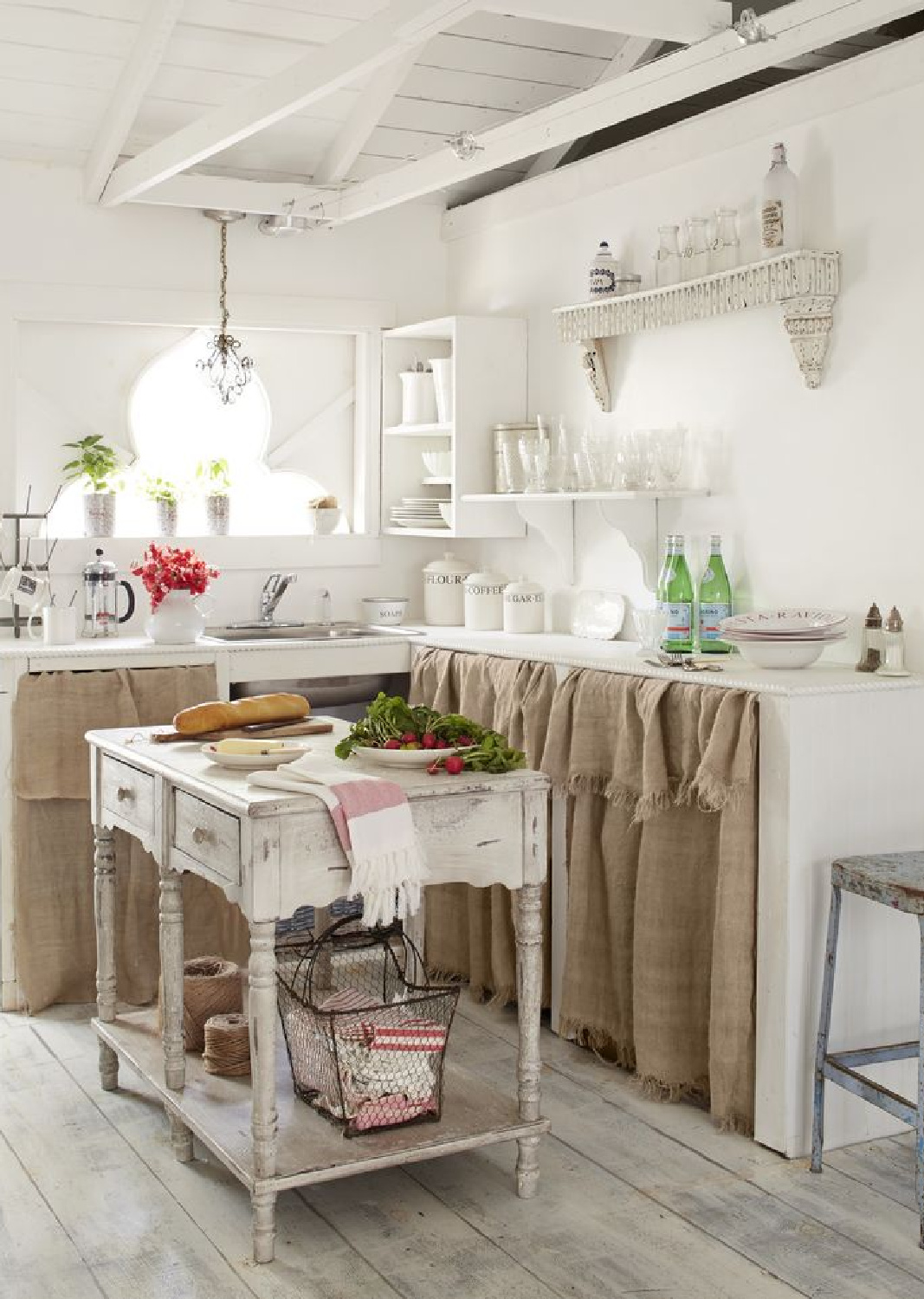 Fifi O'Neill designed kitchen with skirted base cabinets and rustic style (photo by Max Kim-Bee). #rustickitchens #frenchfarmhouse