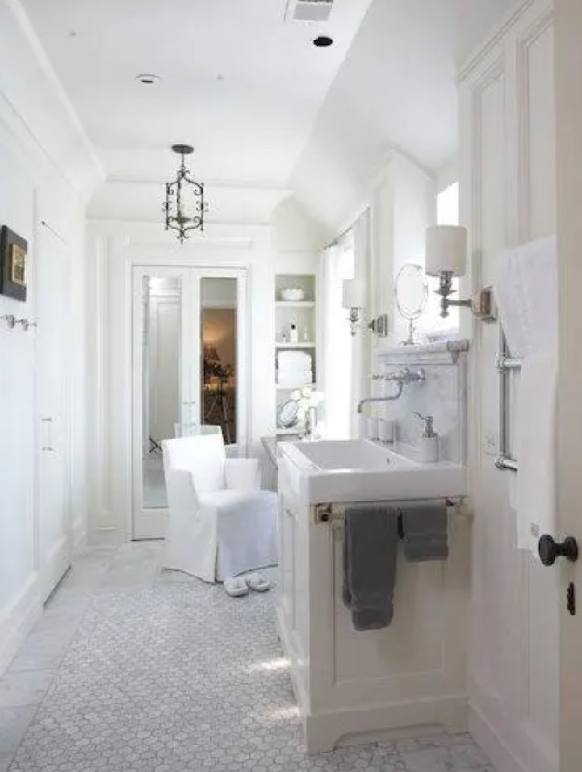 Beautiful white marble bathroom in Alabama (Mountain Brook) flooded with natural light - architecture by Jeffrey Dungan Architects.