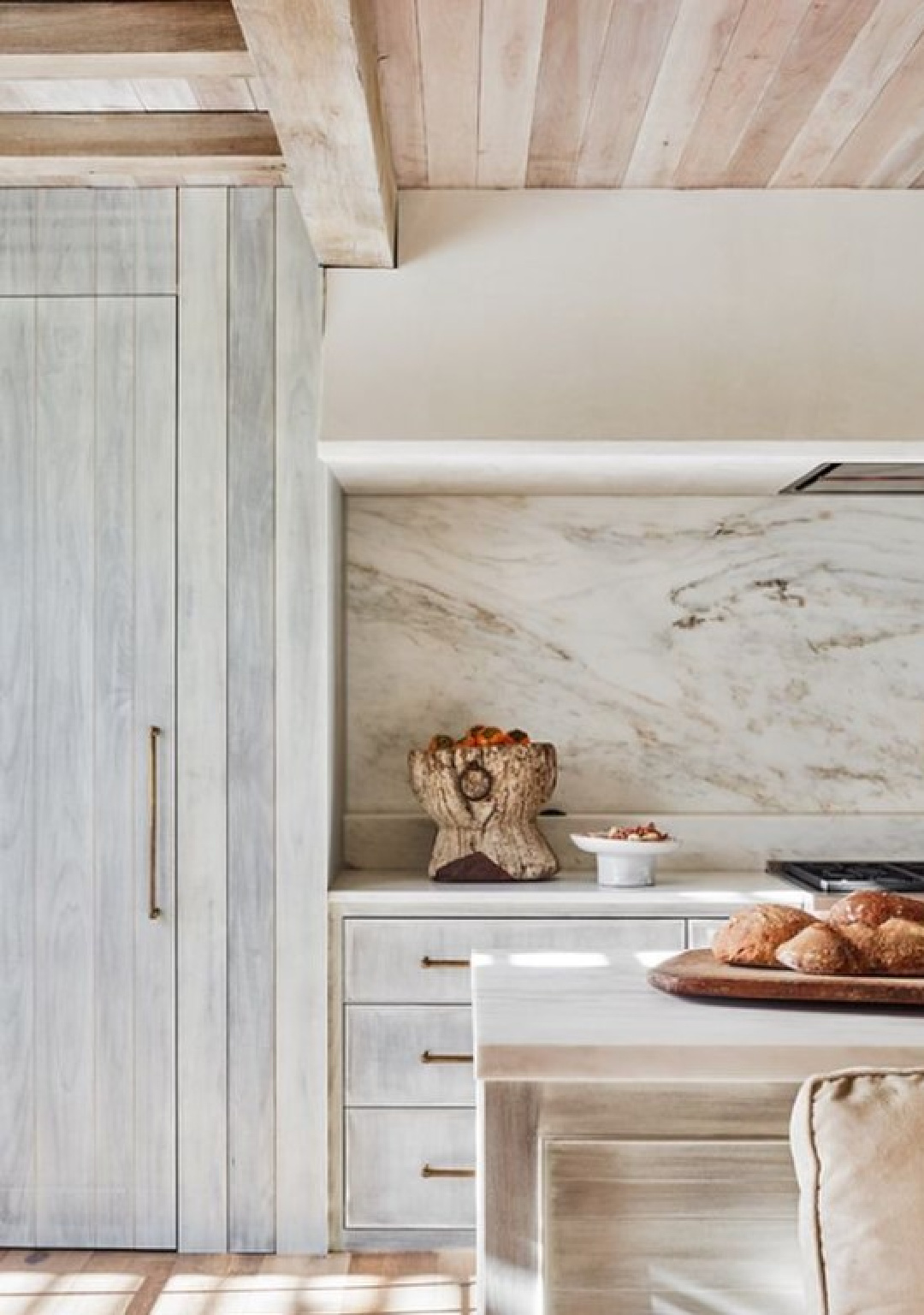 Serene and timeless kitchen with architecture by Jeffrey Dungan Architects.