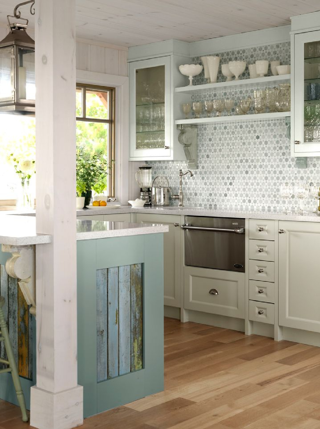 Sarah Richardson designed cottage kitchen with rustic elegant details and soft blue-green color palette - photo by Stacey Branford.