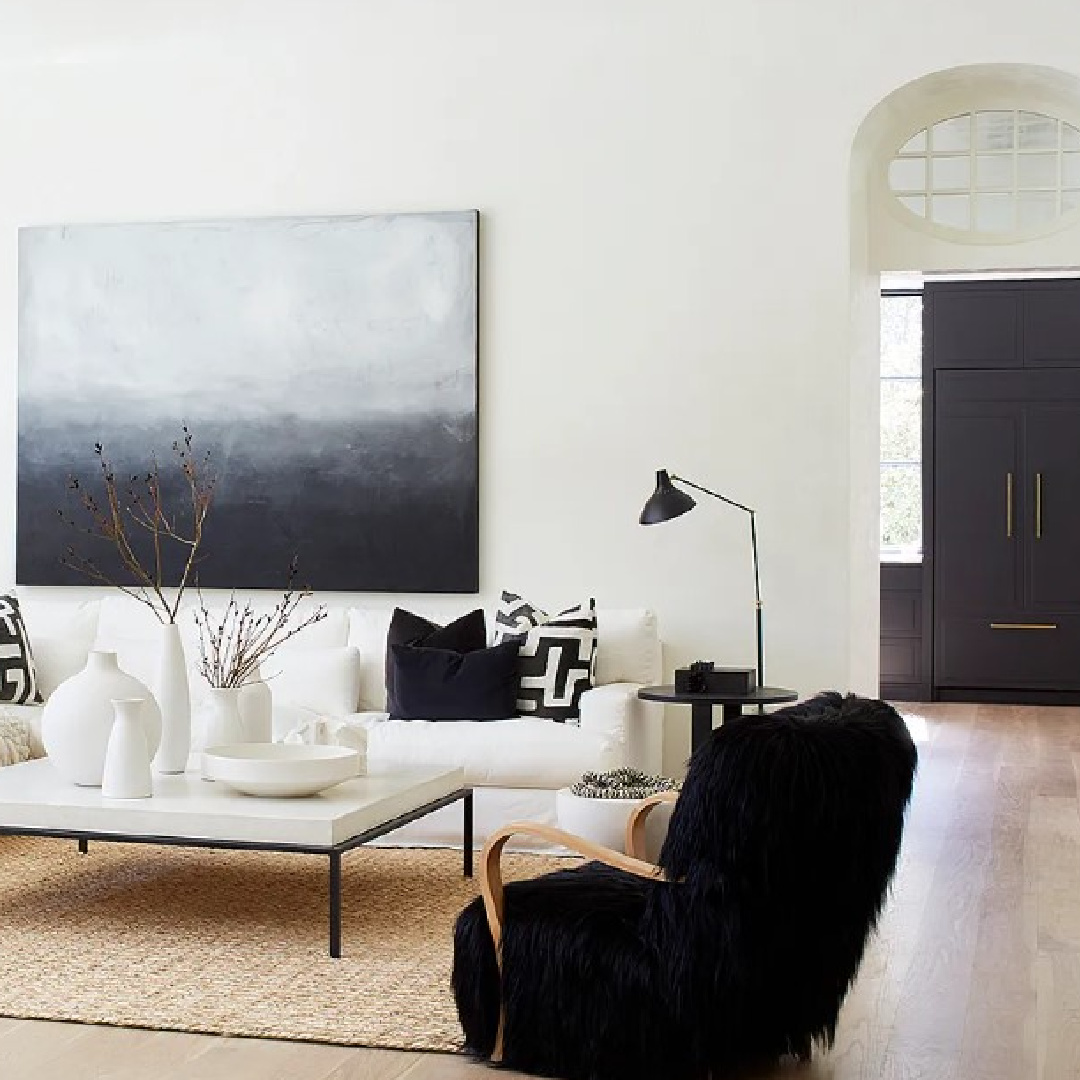 Black and white living room with abstract painting in a luxurious Atlanta home.