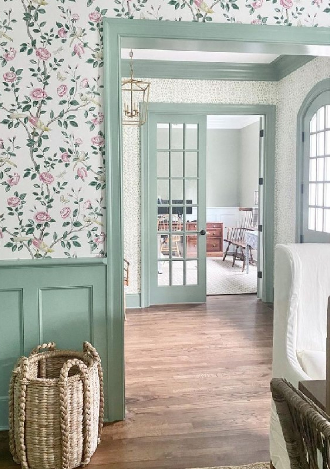 Beautiful renovated entryway with arched door and trim painted Breakfast Room Green by Farrow & Ball. Wallpaper is Brunschwig & Fils Les Touches Peridot - @dianarosespier. #breakfastroomgreen