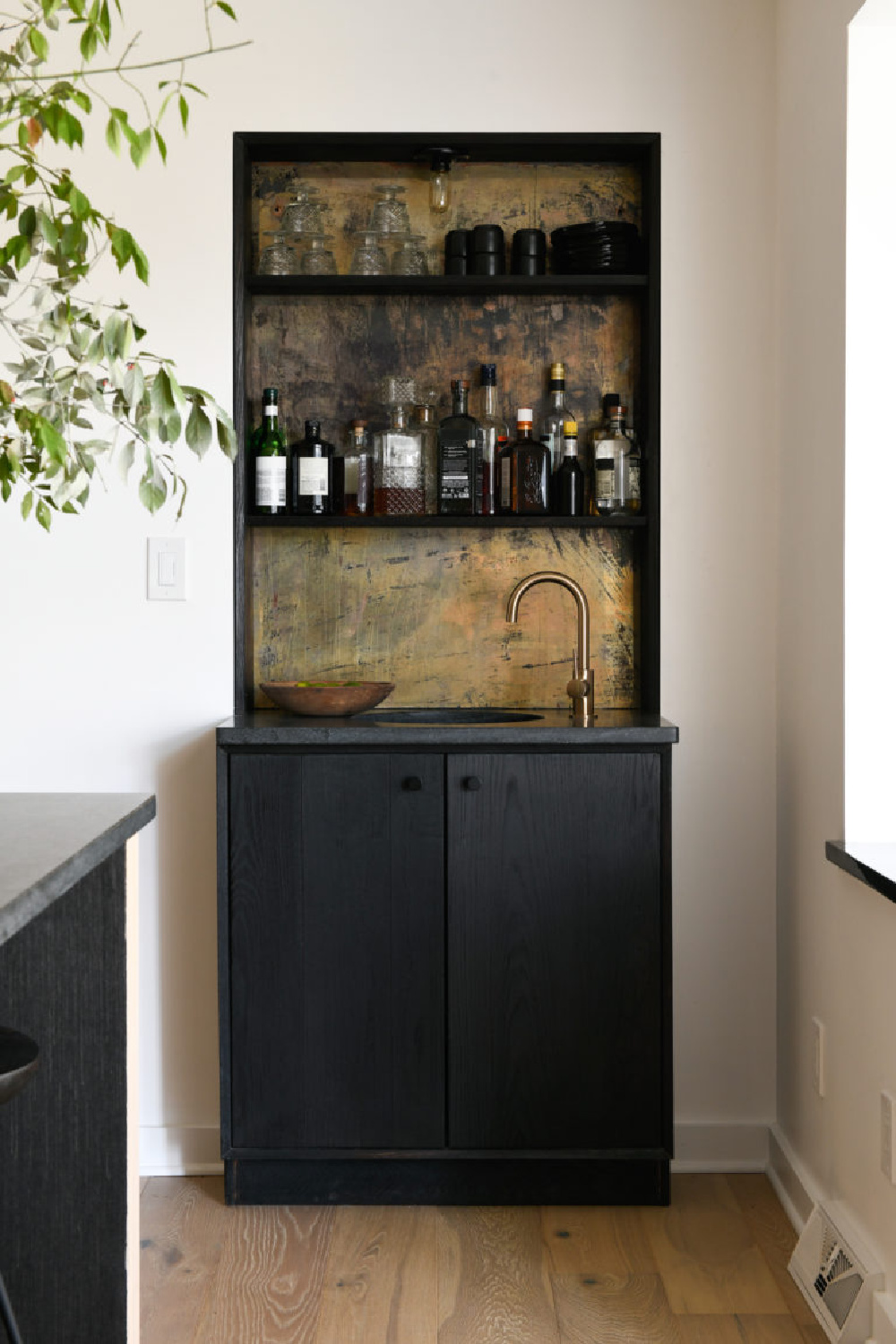 Antiqued mirror (original was copper) is used on the back of a bar with shelves in an episode of HOME AGAIN - design by Leanne Ford; photo by Erin Kelly. #leanneford #antiquedmirror