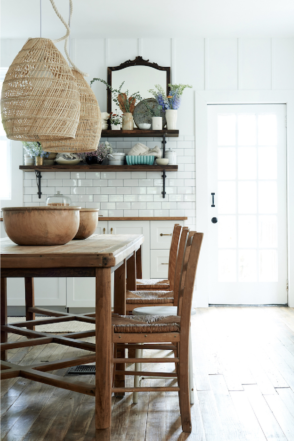 Open shelves in a modern rustic kitchen with subway tile by Leanne Ford. #modernfarmhousekitchen