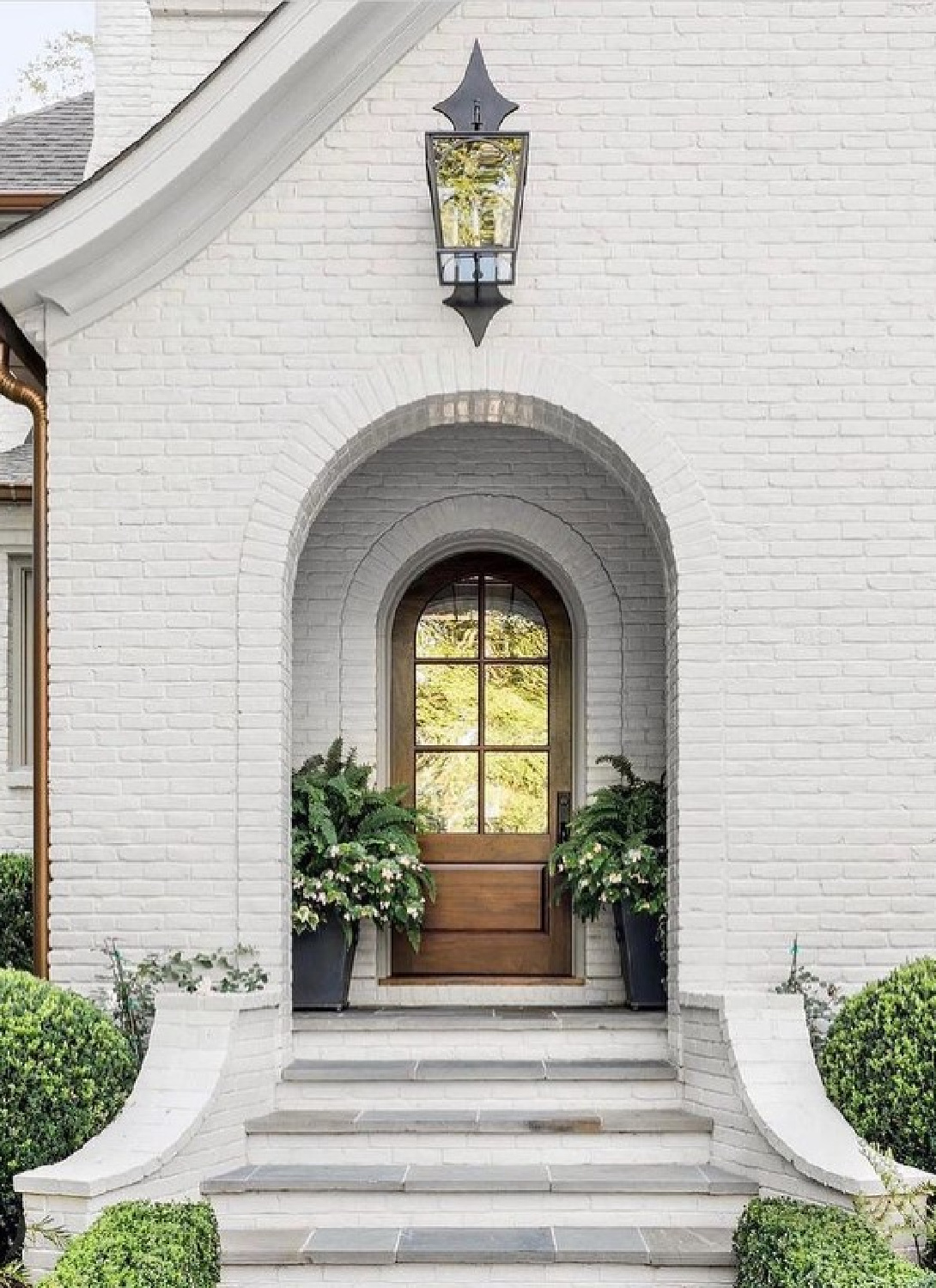 Balboa Mist on a beautiful white brick home by Ladisic Fine Homes - Sherry Hart. #balboamist #houseexteriors