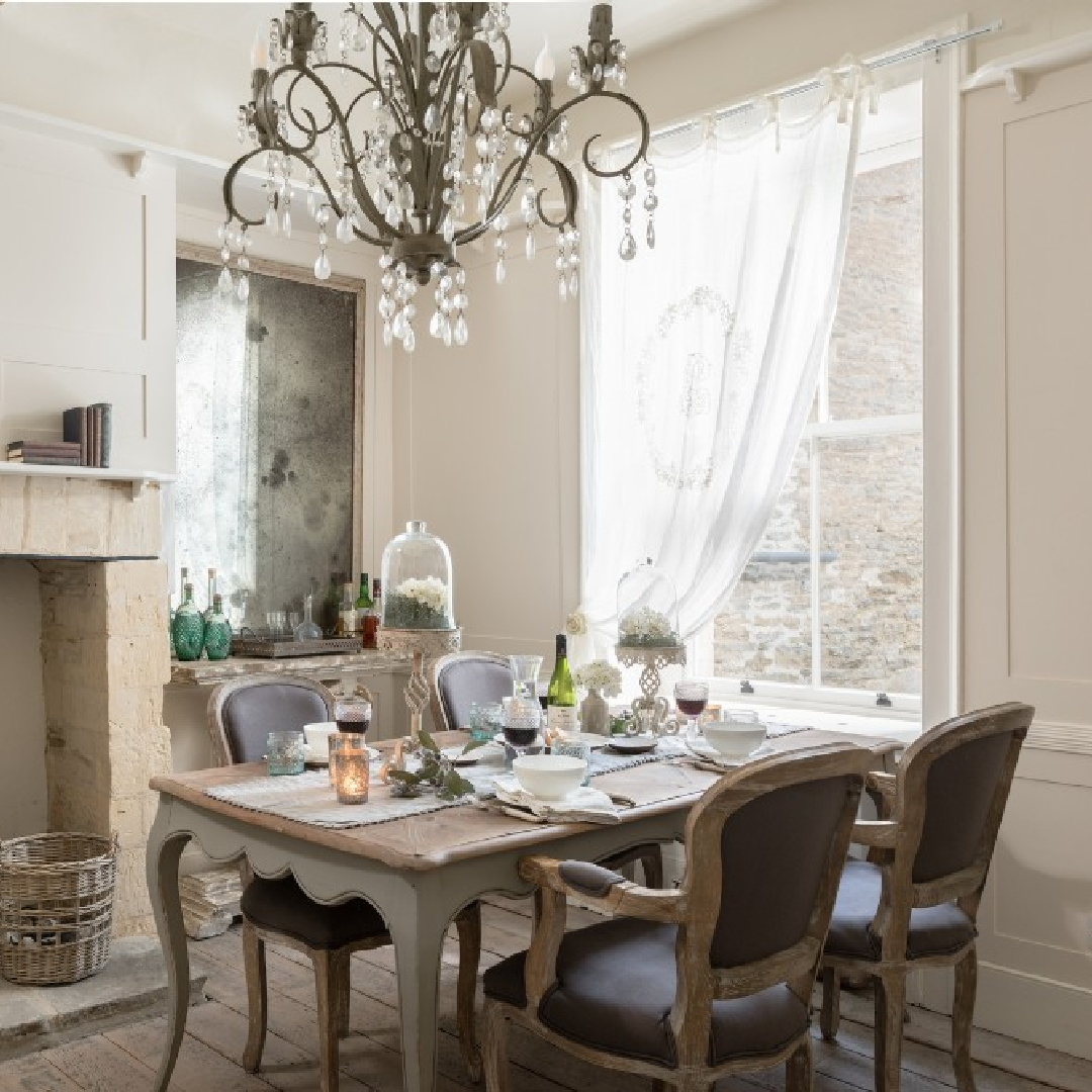 French style dining room with chandelier and fireplace at Flower Press holiday rental Biburg Cotswolds. #cotswoldscottage #englishcountry #cottageinteriors