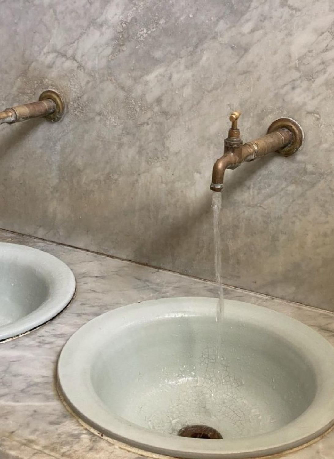 Modern warm rustic bathroom sinks with patinaed brass wall mount faucets - @rebeccagoddard.