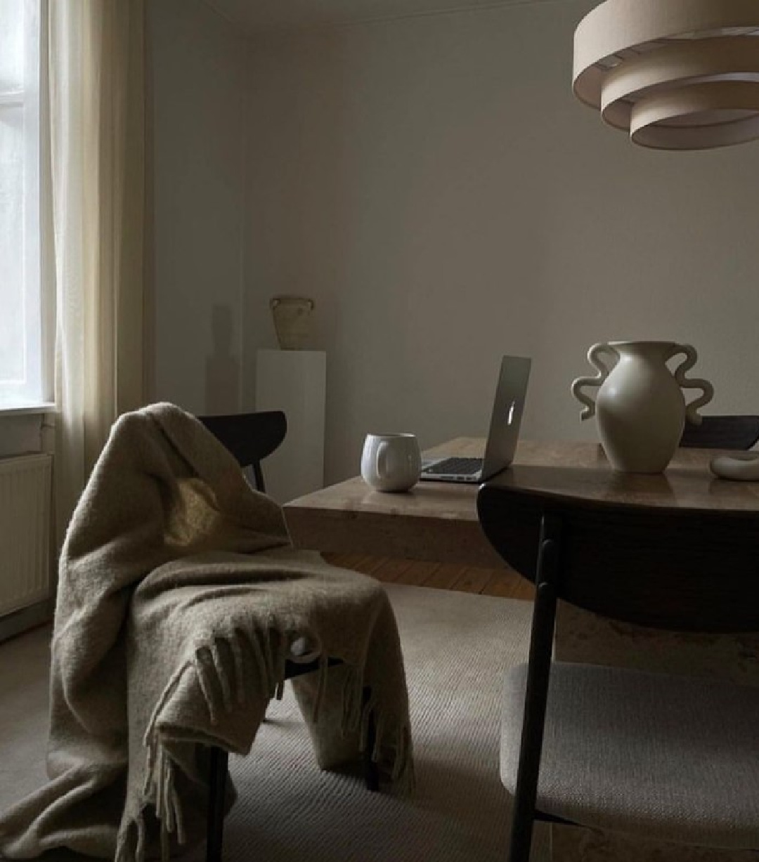 Beautiful serene minimal modern greige vignette with laptop in a dining room - @mathildenauta.