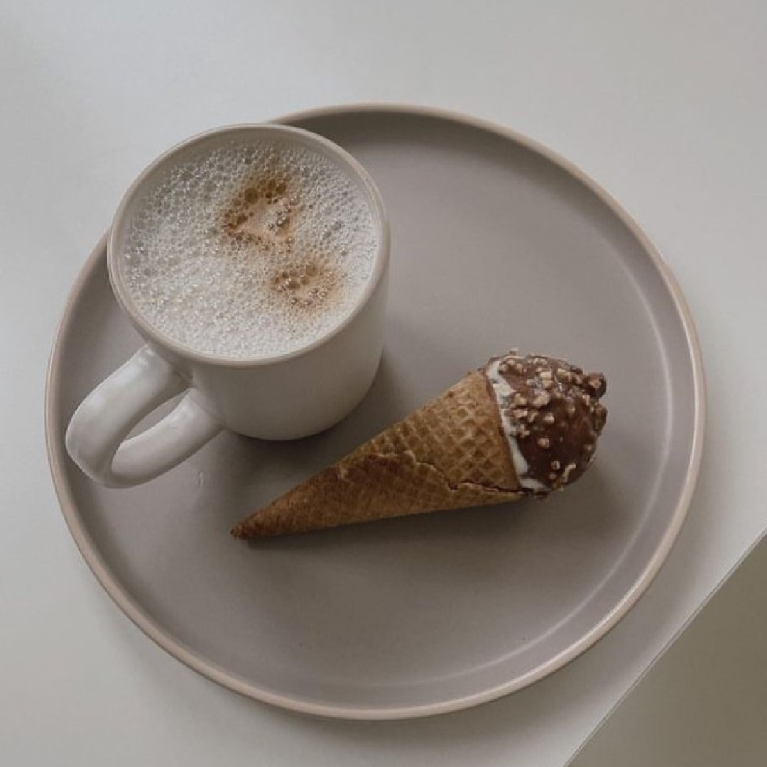 Greige vignette with plate, hot cocoa, and ince cream drumstick - @aniajerecka.