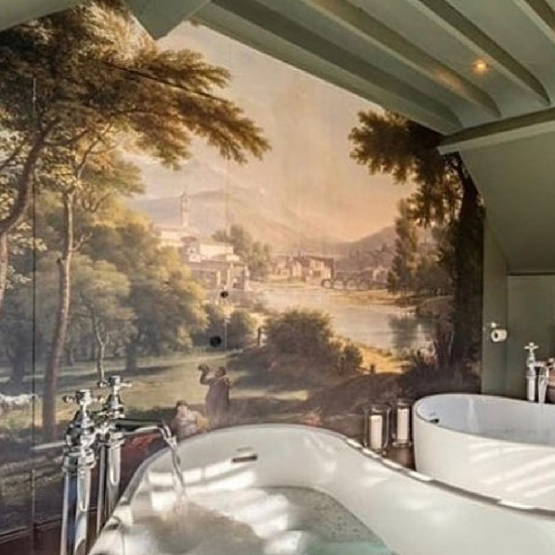 Beautiful scenic landscape mural in a luxurious bath with side by side soaker tubs - Peony Cottage - a vacation rental in the Cotswolds - @peonycottagecotswolds. #cotswoldscottage #englishcountry