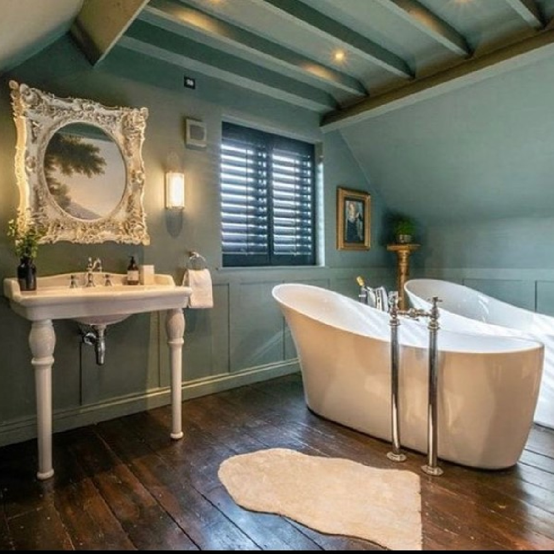 Soaker tub and Victorian sink in deep green bath at Peony Cottage - a vacation rental in the Cotswolds - @peonycottagecotswolds. #cotswoldscottage #englishcountry