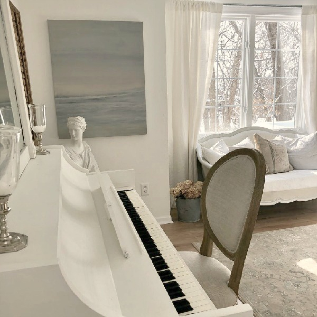 Abstract seascape by Michele of Hello Lovely in a French Nordic style room (BM OC-151) with white piano and settee.