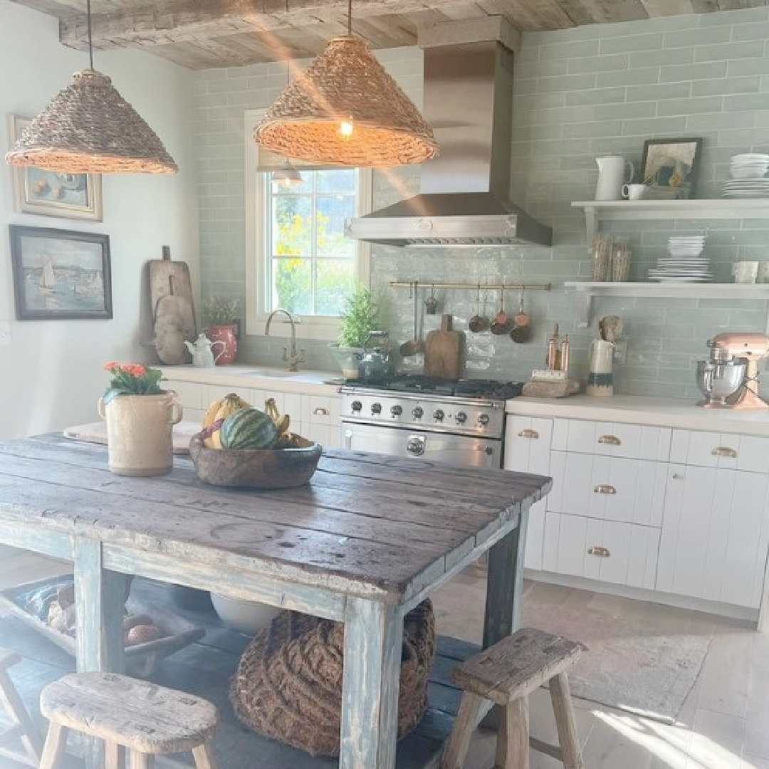 Rustic English country cottage kitchen with low wood ceilings, pale green subway tile, and farm table - @desiree_Ashworth_design. #englishcountrykitchen #modernrustickitchen