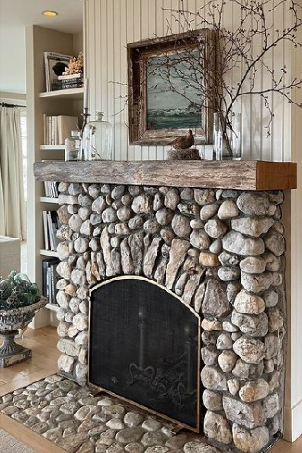 Rustic stone fireplace in a beautiful Cape Cod cottage - @oldsilvershed. #cottagestyle #rusticfireplace