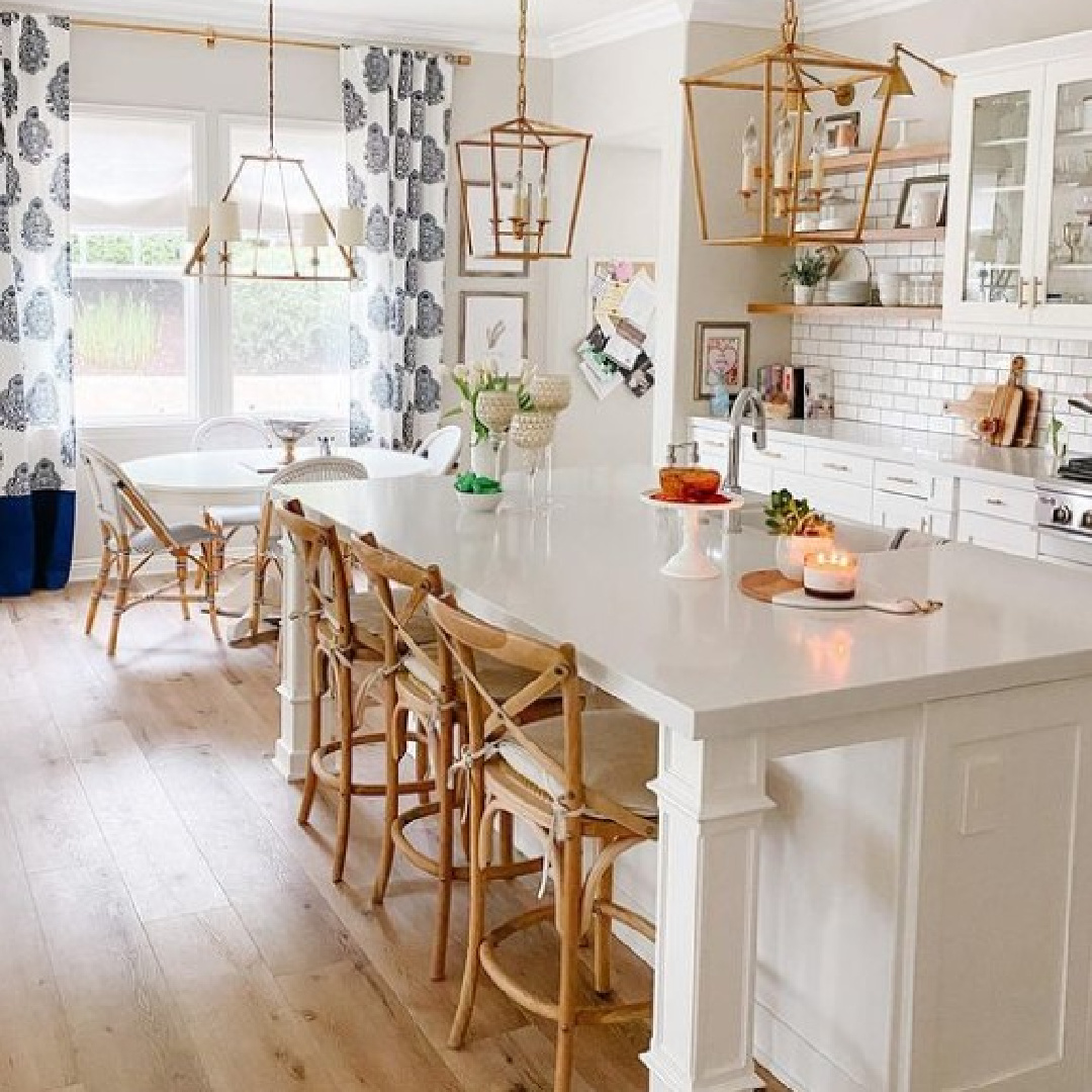 BM Pale Oak Benjamin Moore OC-20 paint on walls in modern farmhouse kitchen with gold lanterns, subway tile, and open shelving - @americancolorks. #bmpaleoak #paleoak