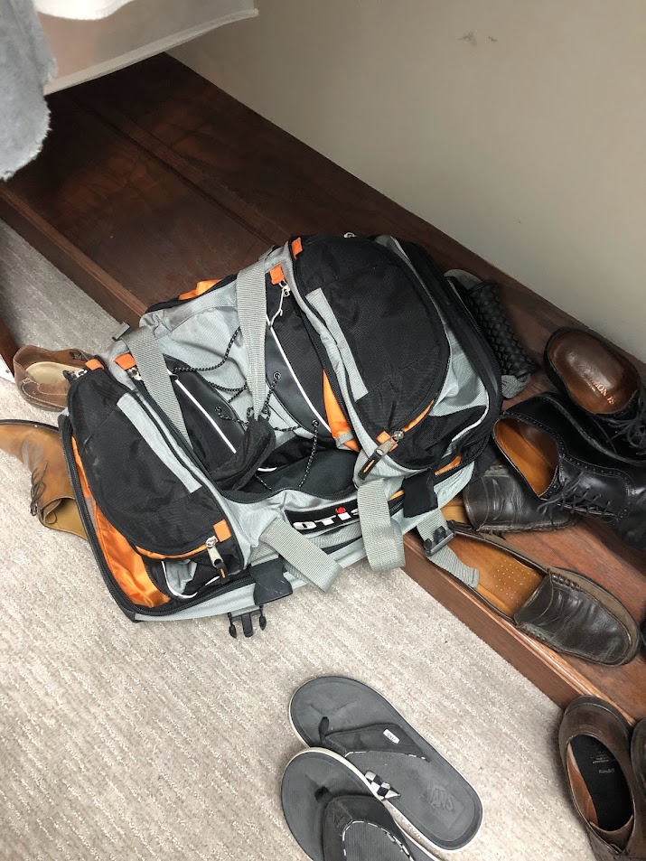 Shoe storage in primary bedroom closet BEFORE