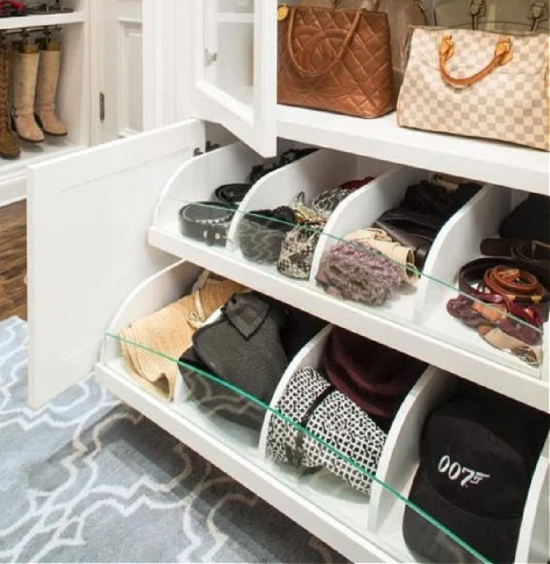 Custom closet with custom rollouts with sections and white shelving - HGTV. #customclosets