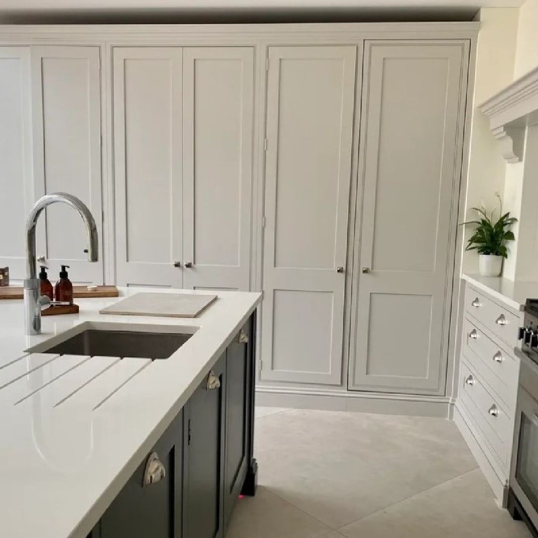 Cornforth White (Farrow & Ball) warm beige kitchen cabinets in an English country kitchen - @Sharon Lacey. #cornforthwhite #farrowandballcornforthwhite #greigepaintcolors