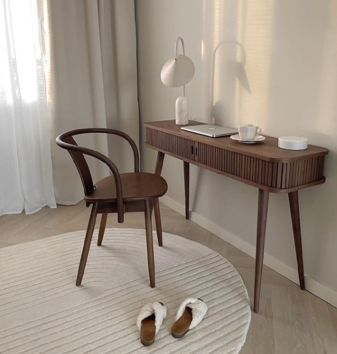 Minimal modern workspace with desk and chair in dark stained wood. @saijis. #midcenturymodern #officedesign