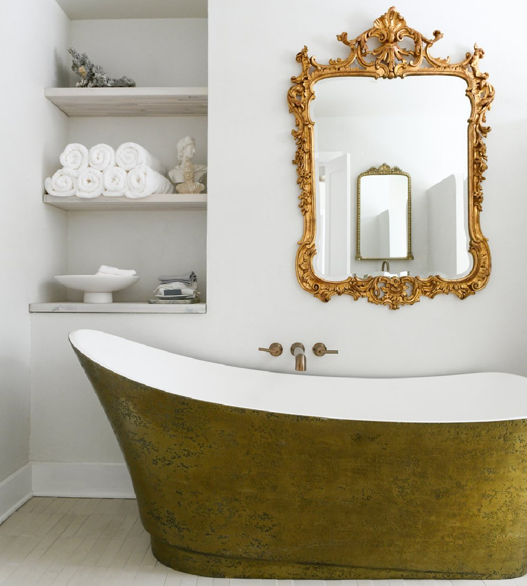 Behr Crisp Linen in a gorgeous bath with brass soaking tub and ornate French gilded mirror (Brookside project - craftsman renovation by Leanne Ford). Photo by Erin Kelly. #behrcrisplinen #leanneford #minimalluxe