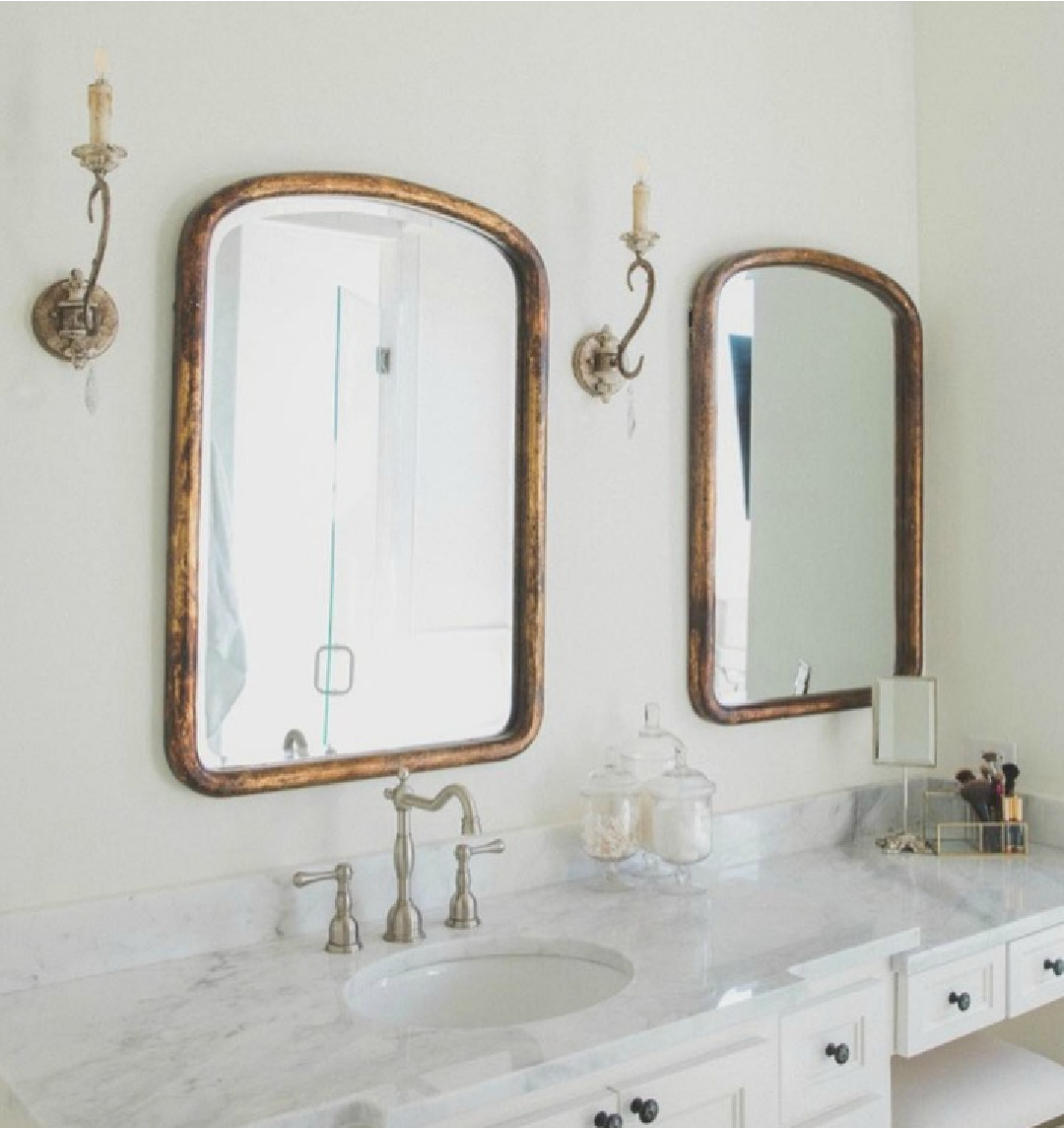 SW Alabaster 7008 paint in a French country bathroom with makeup counter designed by Brittany Jones. #swalabaster