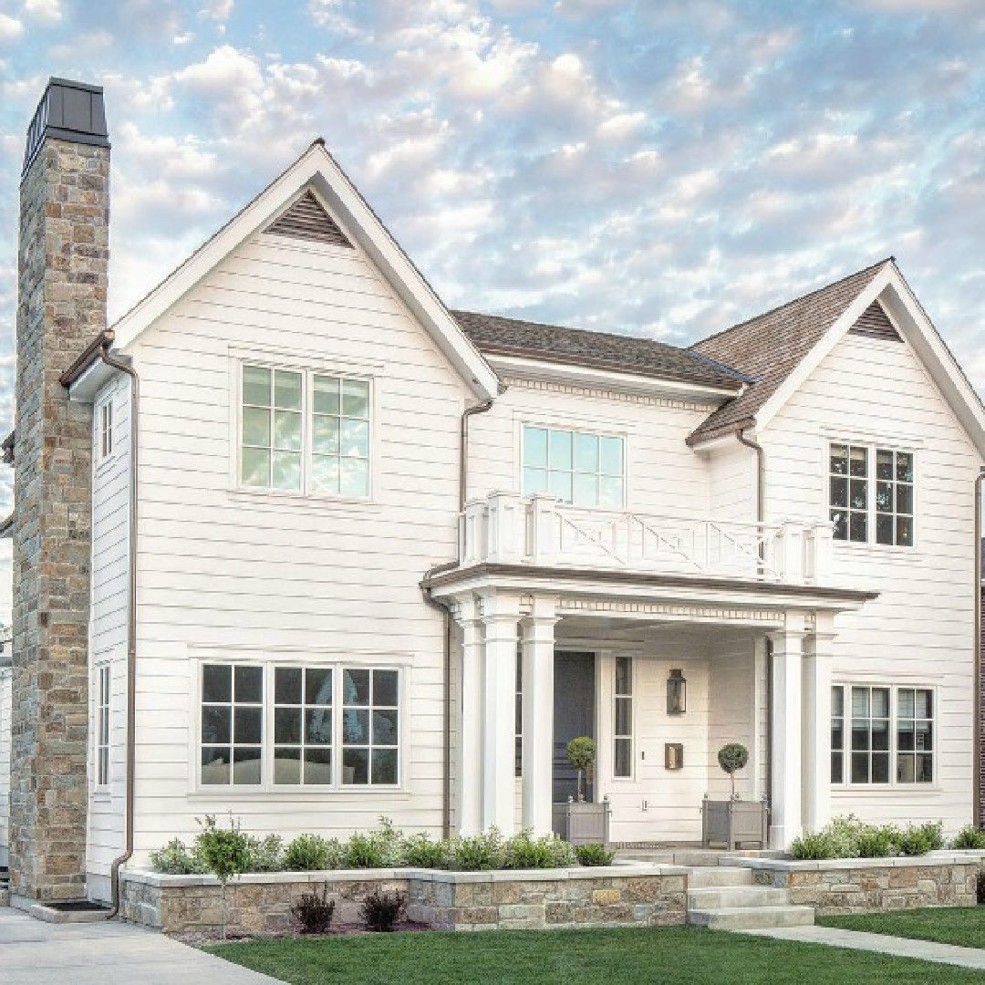 Traditional white home exterior of house designed by The Fox Group. #whitehouseexteriors