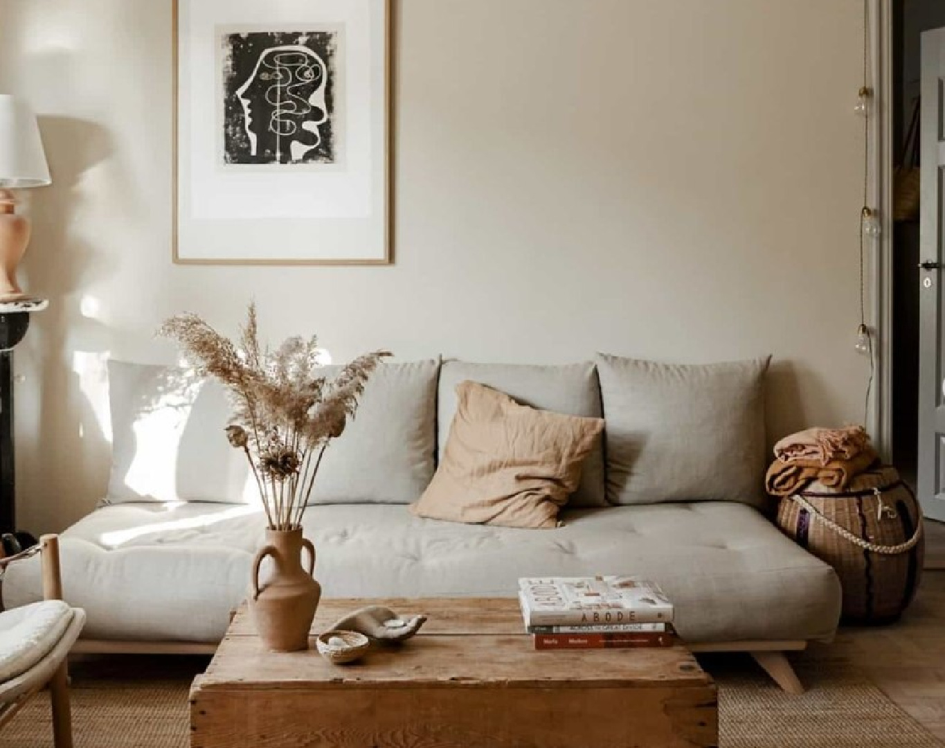 @annamalmbergphoto - beautiful living room of a stylist and photographer's breathtaking Stockholm apartment with rustic textured warmth, serene beauty, and soulfully considered design. #stockholmapartment #scandiinterior #modernrustic