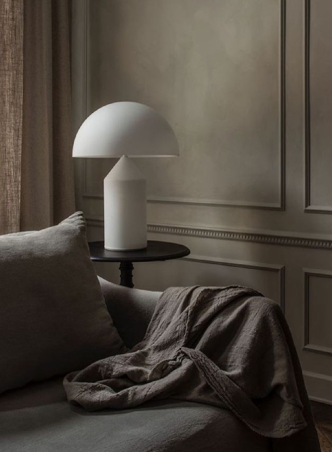 Moody deep earthy colors and modern mushroom lamp in a Stockholm apartment - @perspectivestudio. #stockholmapartment