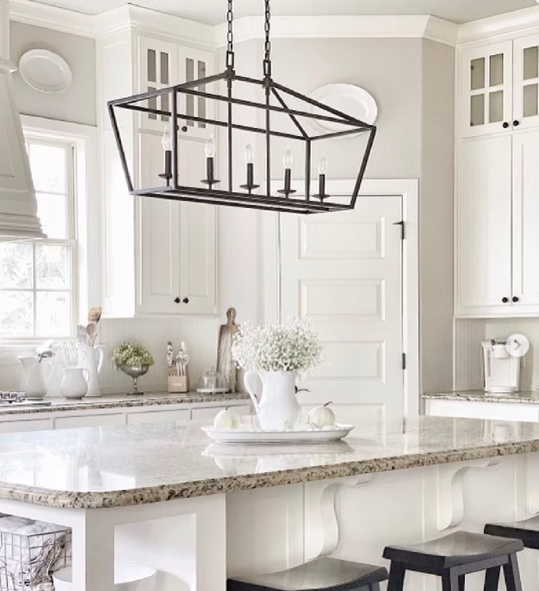 BM China White on kitchen cabinets in a lovely cottage kitchen with grey walls and black accents - Mavenhaven. #bmchinawhite