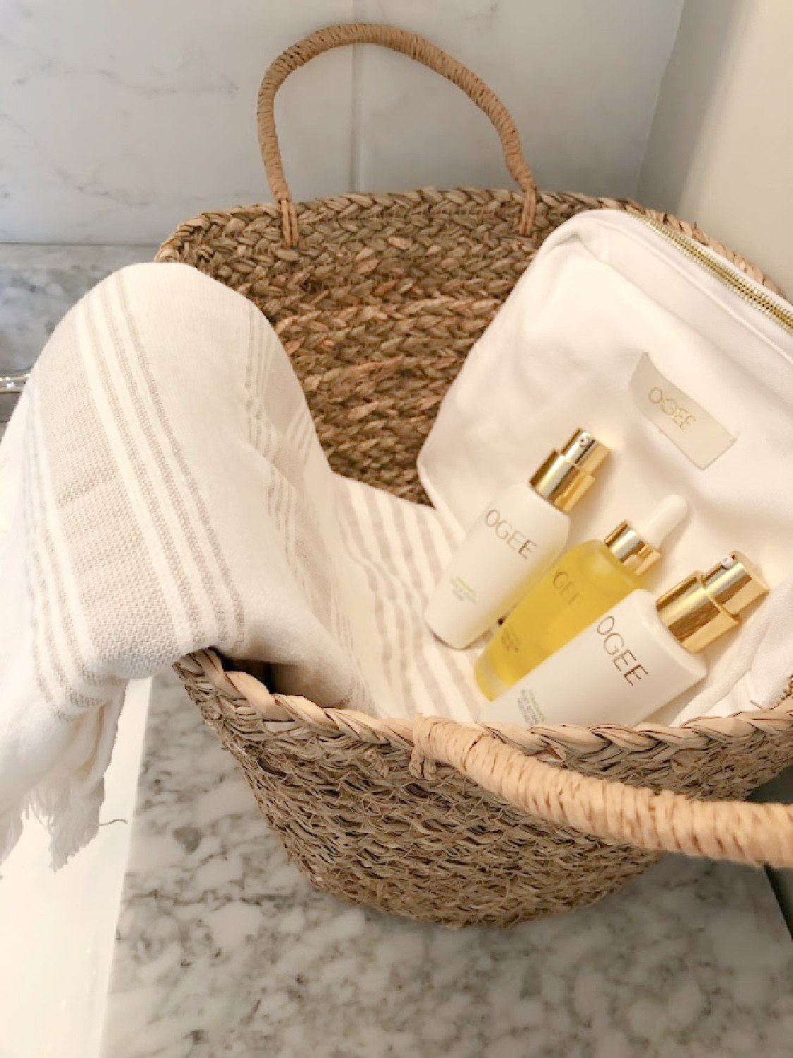 OGEE Glow trio organic skincare potions in a basket on my vanity counter - Hello Lovely Studio. #ogee