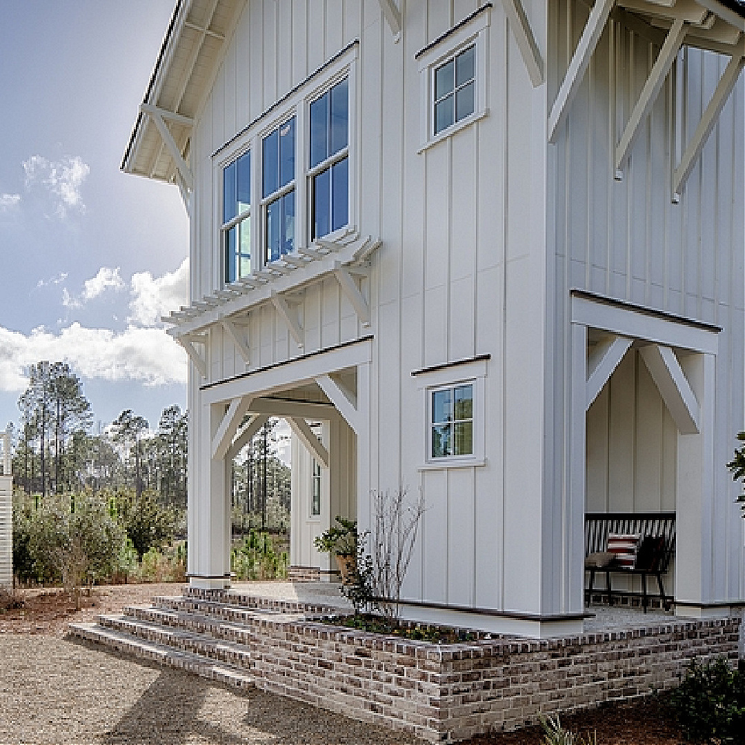 Board and batten  cottage porch with red brick skirt - Lisa Furey. #palmettobluffshouse #porchdesign