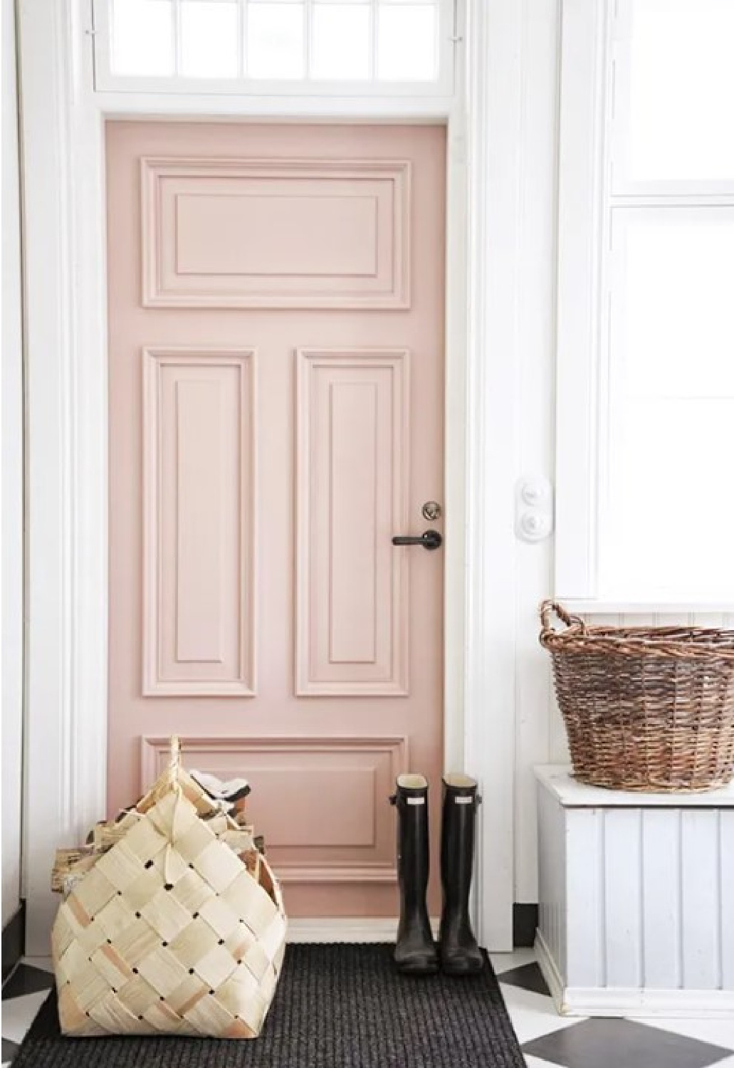 Pink painted door (Farrow & Ball Pink Ground) in a London rowhouse with boots, basket, and checkered floor. #farrowandballpink #pinkground