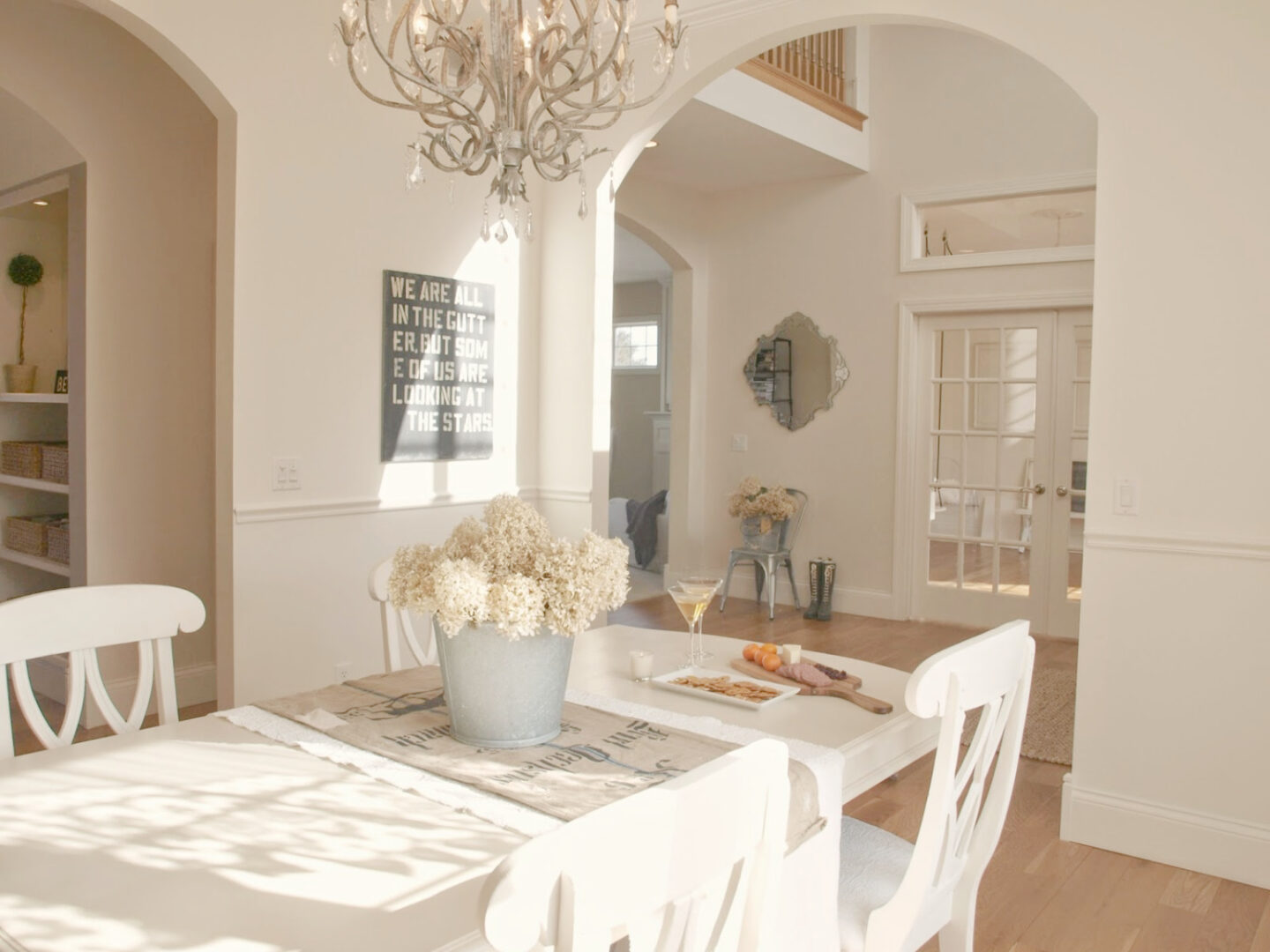 BM White Sand in our French country dining room with antique grainsack runner and galvanized bucket of hydrangea - Hello Lovely Studio. #hellolovely #bmwhitesand #frenchcountrywhites