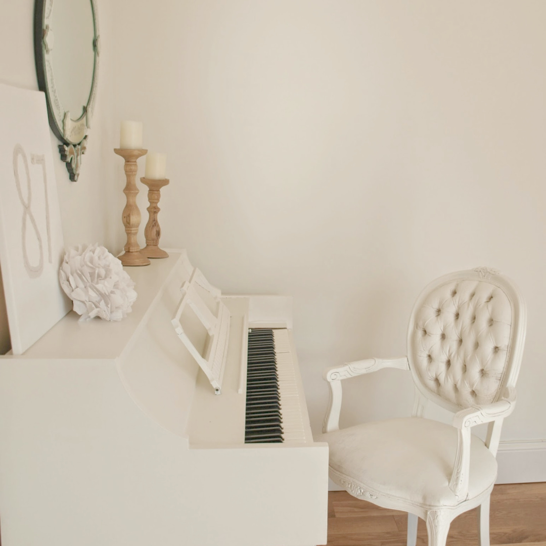 BM White Sand in my music room with white piano painted BM White Dove - Hello Lovely Studio. #bmwhitesand