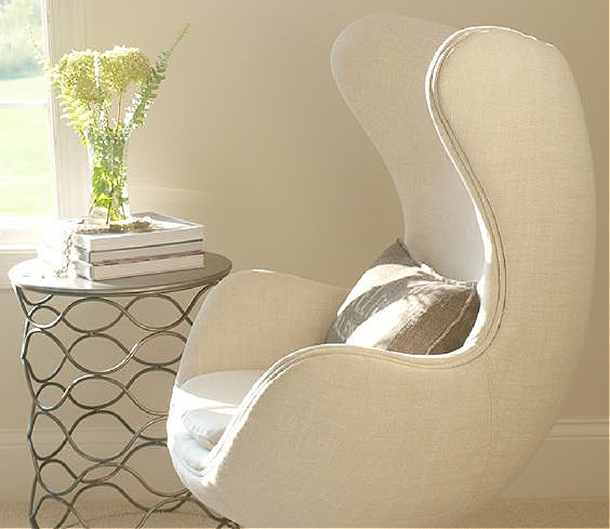 Benjamin Moore White Sand paint color in Hello Lovely's living room with Belgian linen Copenhagen egg chair. #bmwhitesand #benjaminmoorewhitesand #hellolovelystudio