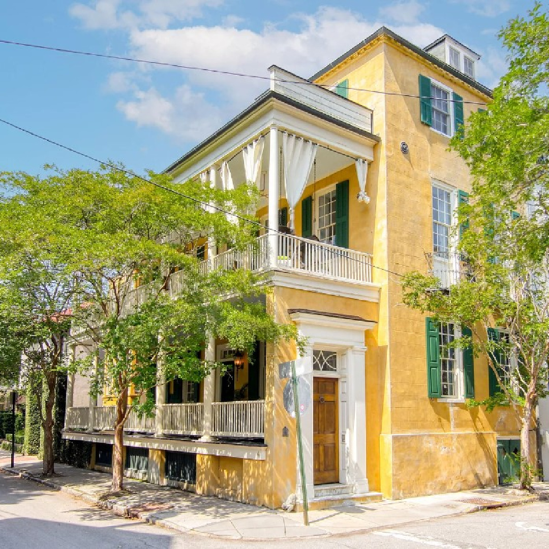 Gorgeous yellow home exterior with green shutters on a 1777 built home in Charleston, SC (4 Legare St.). #charlestonhomes #yellowhouses