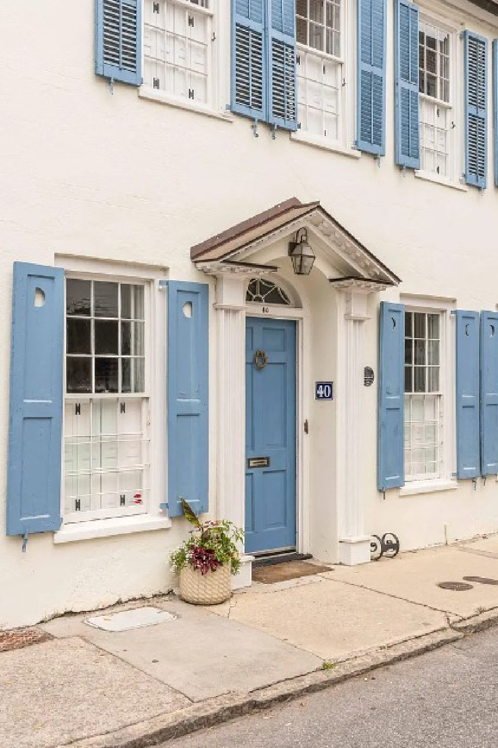 Beautiful Charleston exterior with French blue shutters - 40 Tradd St. was built in 1718 and appeared in "The Patriot." #charlestonhomes #18thcenturyhomes #historichouseexteriors