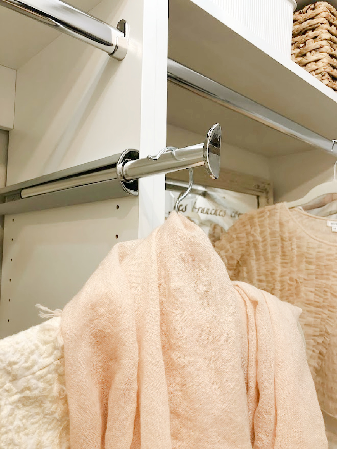This closet valet extendable hook in our DIY custom closet makes getting dressed so much more fun and feels shop-like at home! From Modular Closets - come see Hello Lovely's DIY closet. #closetaccessories #closetfeatures #valethooks