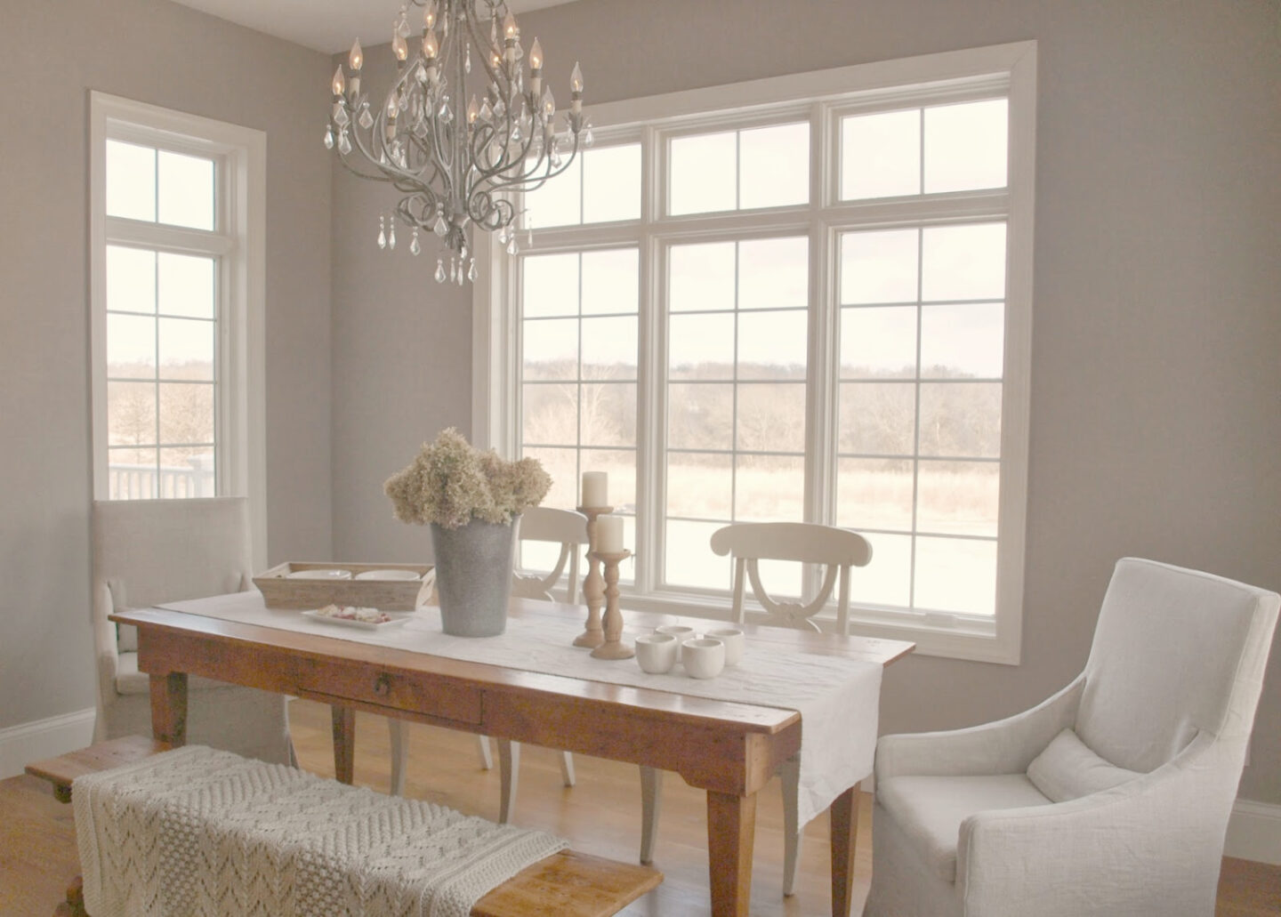 Ashley Gray (Benjamin Moore) in my French country kitchen with Silestone Ivory Coast counters, warm white Thomasville cabinets, and white oak hardwood flooring - Hello Lovely Studio. #bmashleygray #hellolovely #frenchkitchens