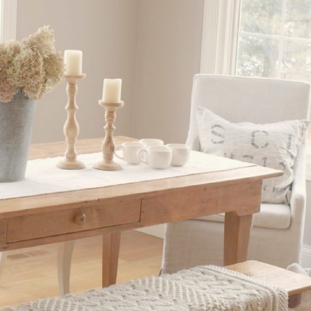 Ashley Gray (Benjamin Moore) in my French country kitchen with Silestone Ivory Coast counters, warm white Thomasville cabinets, and white oak hardwood flooring - Hello Lovely Studio. #bmashleygray #hellolovely #frenchkitchens