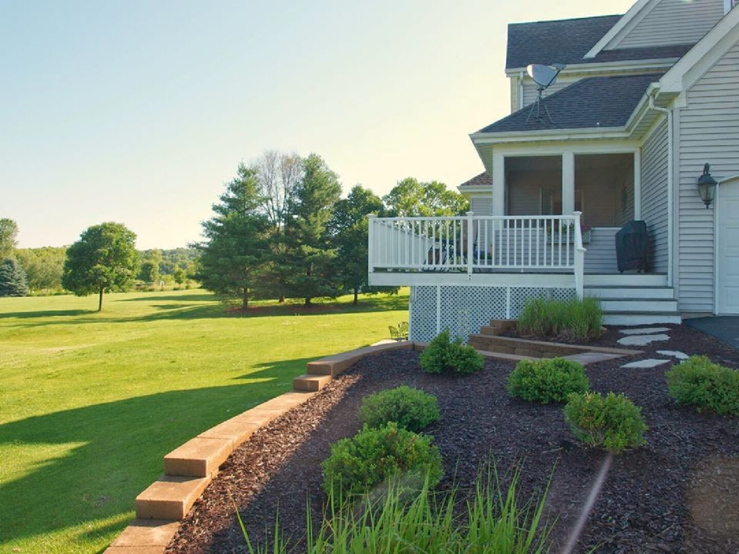 Our backyard and screen porch at our French country style home - Hello Lovely.