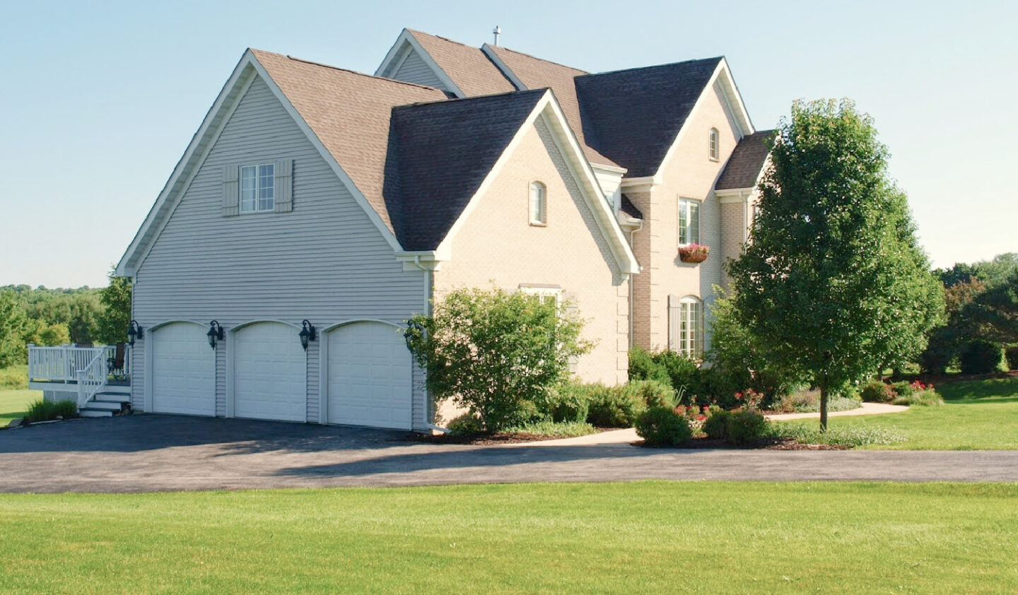 Hello Lovely designed this French country white brick with shutters French country manor house built in a country neighborhood. #hellolovely #frenchcountryexterior