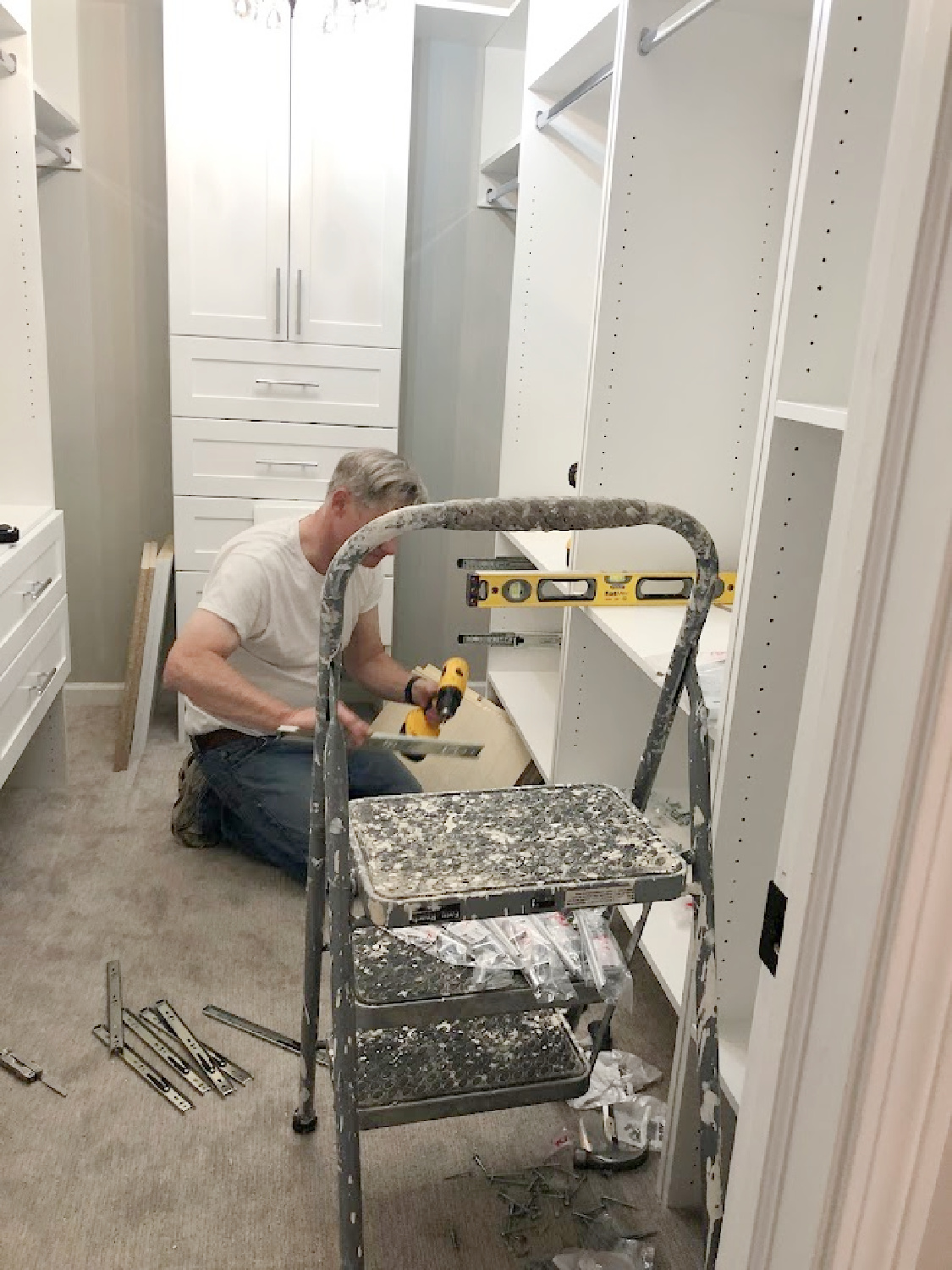 Progress shot of closet drawers being assembled for our DIY closet - Hello Lovely Studio.