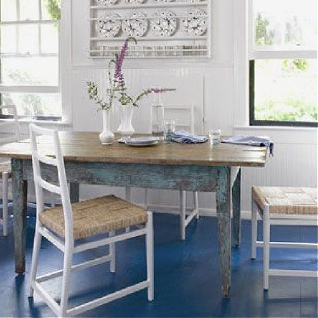 Alex Bates designed country kitchen with rustic farm table and cheerful coastal blue painted floors - Country Living magazine. #bluekitchens