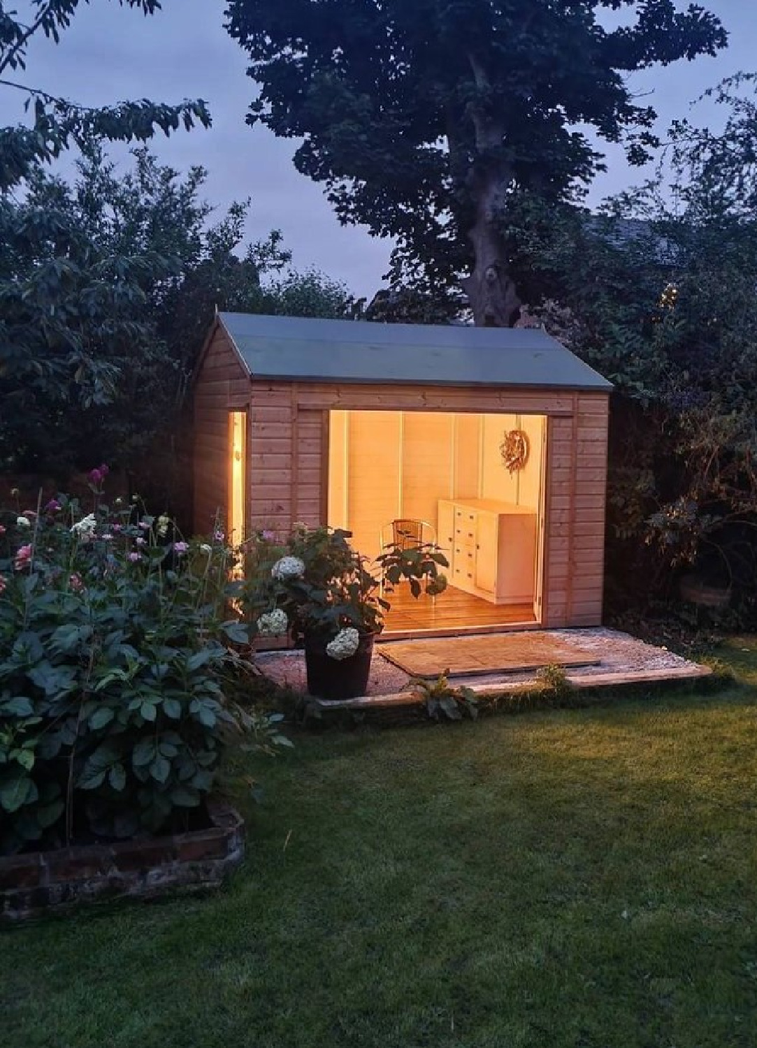 Backyard she shed glowing inside - @simplythenest. #shesheds #sheshedstyle