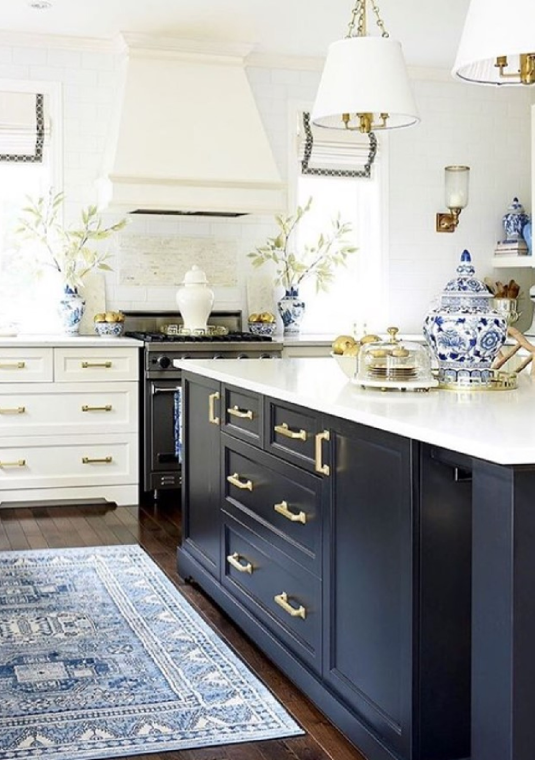 Classic, Shaker style kitchen with navy blue island, blue area rug, blue porcelain accents and traditional style - Citrine Living. #blueandwhitekitchen